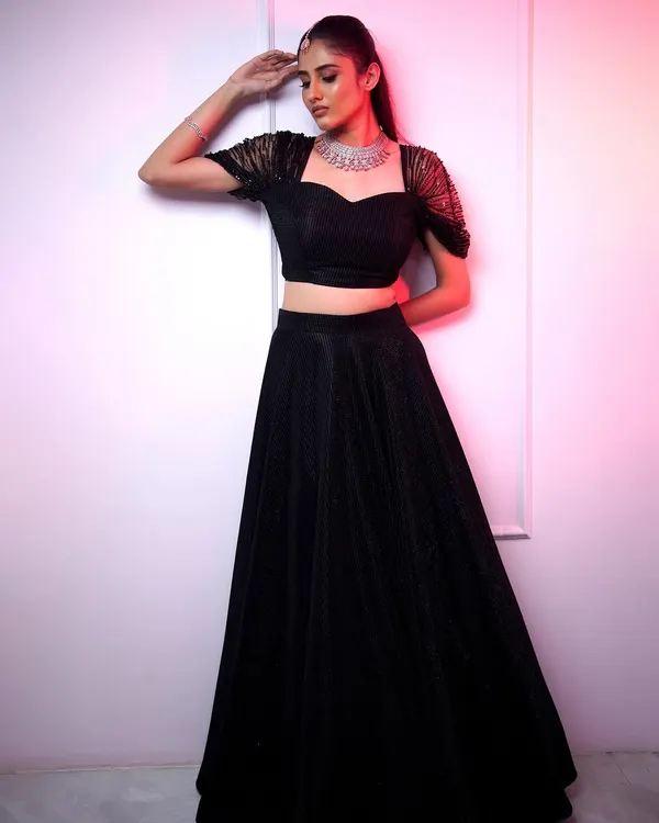A stunning wedding guest look featuring our sleek American diamond choker. It's the perfect accessory for a modern black lehenga, adding just the right amount of sparkle.