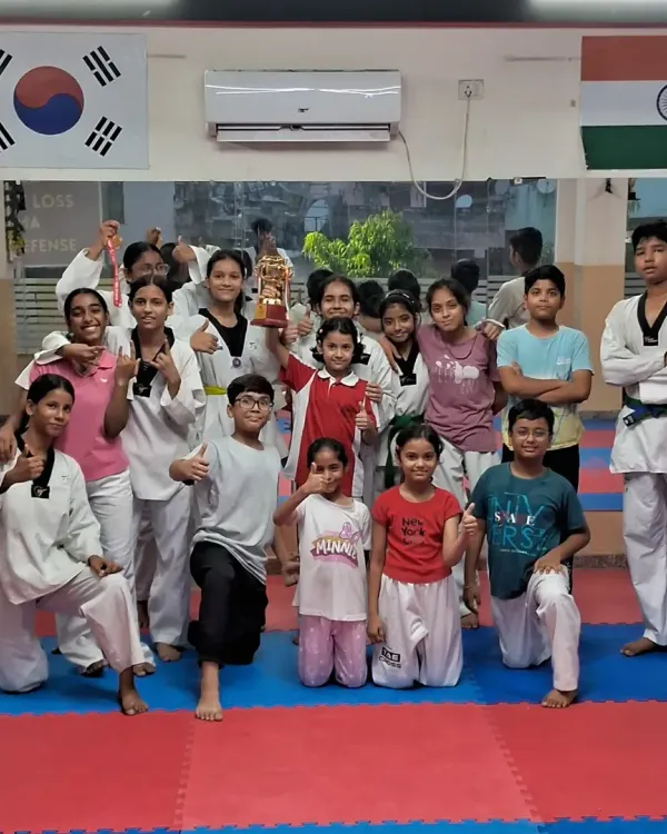 Our team at TaeCross Sports Academy. We foster a supportive community where students of all ages and belt levels train together and motivate each other.