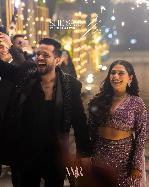 That "She Said Yes!" moment. We love creating the perfect backdrop for these life-changing memories, but the real magic is the pure, unscripted joy on the couple's faces. Here, they celebrate with sparklers after the proposal.