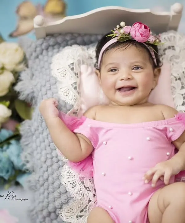 This is the kind of pure, unfiltered joy I aim to capture in every session. This little poser's happy smile, captured during her 45-day milestone shoot, is absolutely infectious.