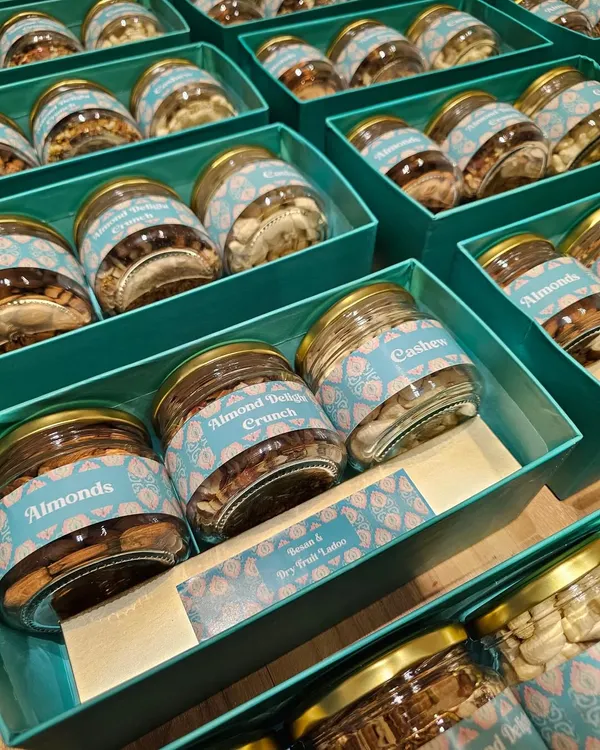 This is a look inside the corporate gift boxes I made for Divine Chairs. The boxes were filled with jars of premium almonds, cashews, and almond crunch, all featuring custom labels that match the client's branding.