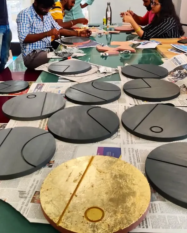 We believe in adding a personal touch to our spaces. These circular wall art pieces were designed and crafted in our own studio for a client's home. Made with wood, vegetable dyes, and gold and silver leaf, they represent the phases of the moon and add a layer of bespoke artistry to the interior.