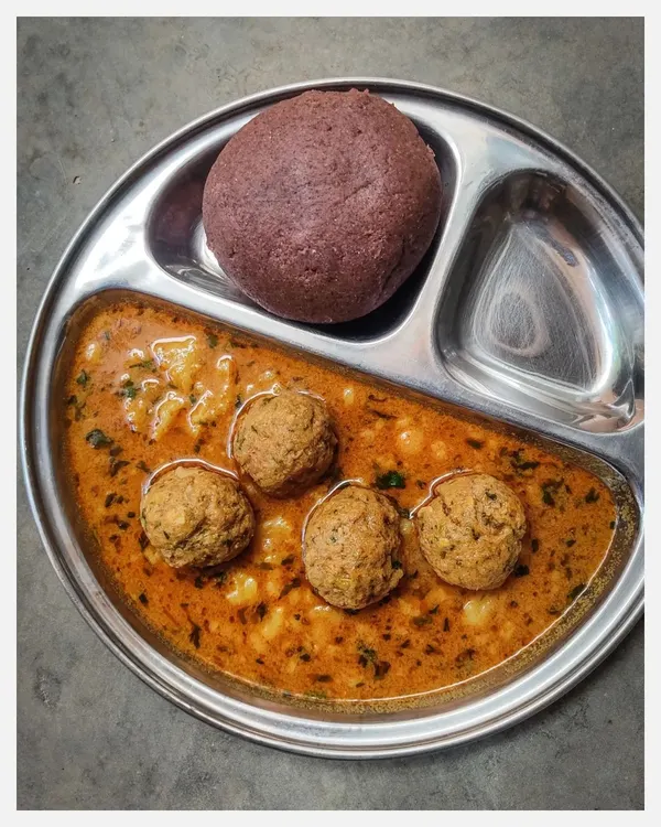The perfect pairing: my Khaima Unde Saaru with a hot, steaming Ragi Mudde. The earthy flavour of the finger millet ball is the ideal vessel to soak up the rich, spicy gravy of the minced lamb meatballs. This is soul food, the traditional way.