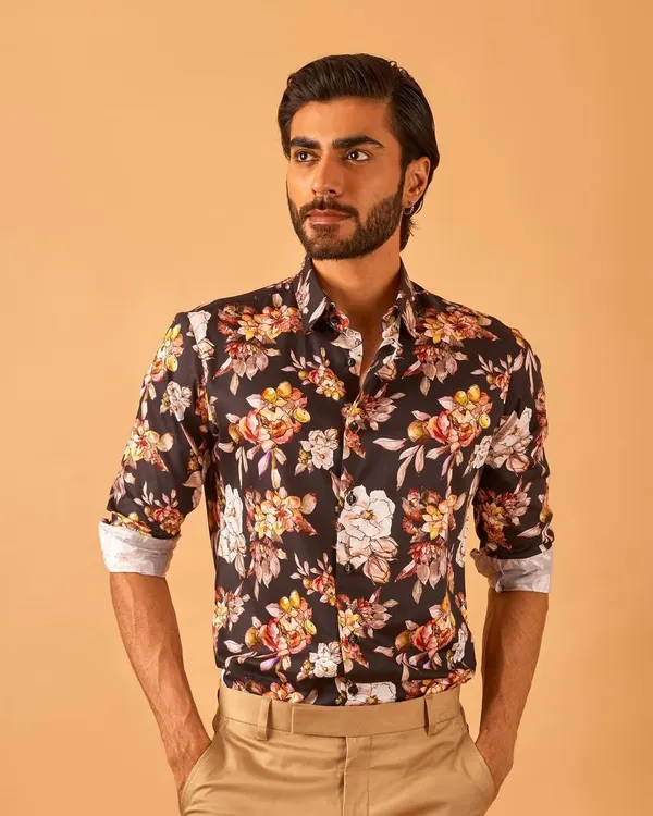 A bold floral print shirt is a great way to make a statement. We custom-stitch our shirts for a perfect fit, ensuring you look sharp whether you wear it alone or under a blazer.