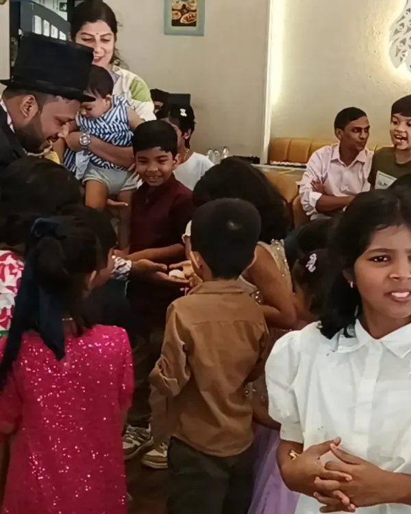 A magician from my team performing for an excited group of children at a birthday party in Navi Mumbai.
