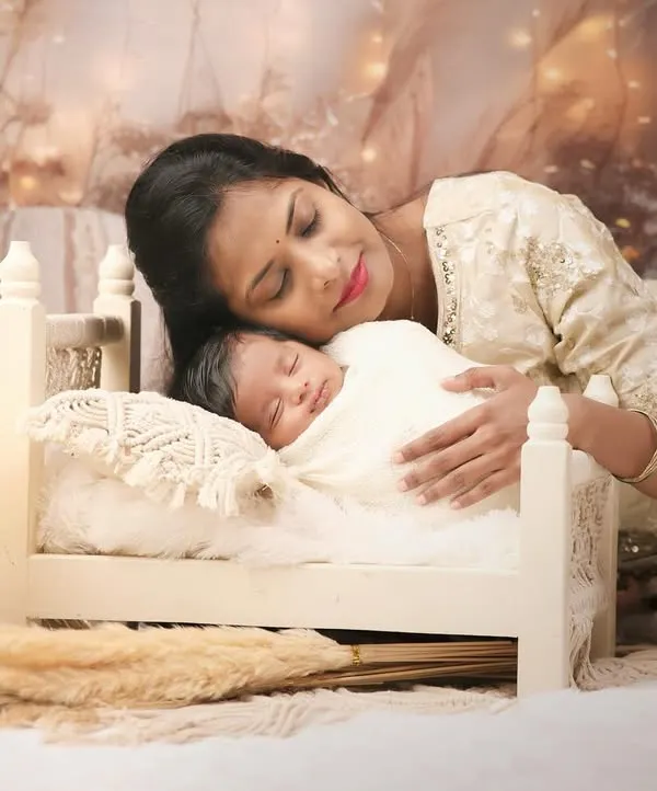The bond between a mother and her newborn is a story I feel privileged to capture. In our cozy studio, I create a serene and warm environment for these tender moments, focusing on the quiet love and connection.
