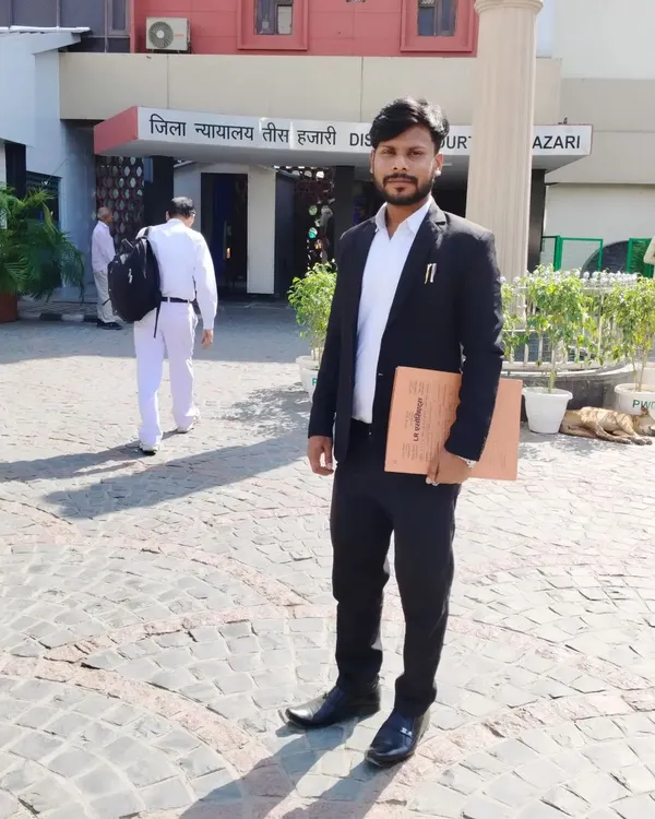 I am Advocate David Chaudhary, pictured here at the Tis Hazari District Court. When you are facing a tough legal battle, you need a lawyer who is present and prepared. I stand with my clients at every step, ensuring their case is represented with strength and integrity.
