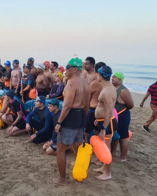The team gathers on the sand before the 90 Minute Ultimate Sea Swimming Challenge. This is a moment of focus and shared purpose before we face the water together.