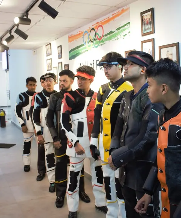 A pre-match briefing in progress. I ensure every shooter understands the rules, procedures, and mental strategy before they step up to the firing line for a competition simulation.