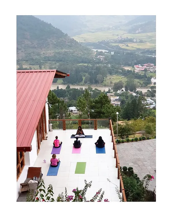 Our yoga shala in the sky. During our Bhutan retreat, we practice together overlooking the Punakha valley, with views of the historic dzong and the meeting of two rivers. This outdoor group setting is the perfect space to breathe, move, and feel connected to nature.
