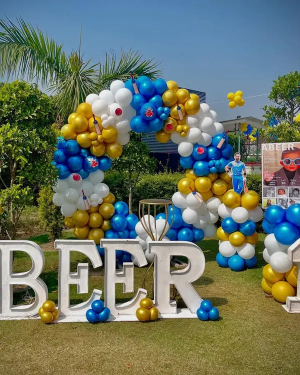 This is the hero item. A grand first birthday celebration with a custom cricket theme for a little champion. This outdoor setup includes a large balloon arch, personalized name and age displays, and themed cutouts to create an immersive experience.