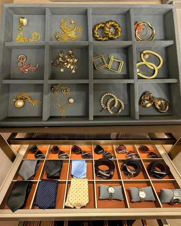 Luxury is in the details. This image shows how we create dedicated, elegant storage for both men's and women's accessories, from jewelry and earrings to ties and watches.