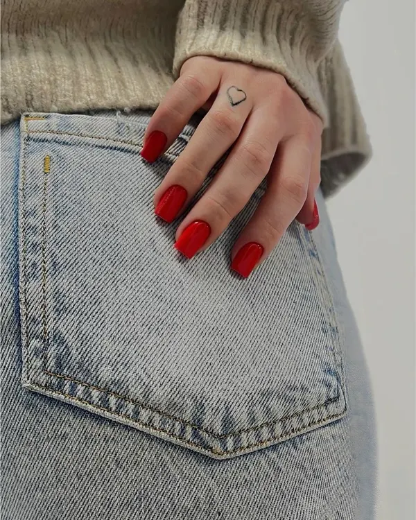 A classic, vibrant red on a short, natural nail shape. It's a timeless look that never fails.