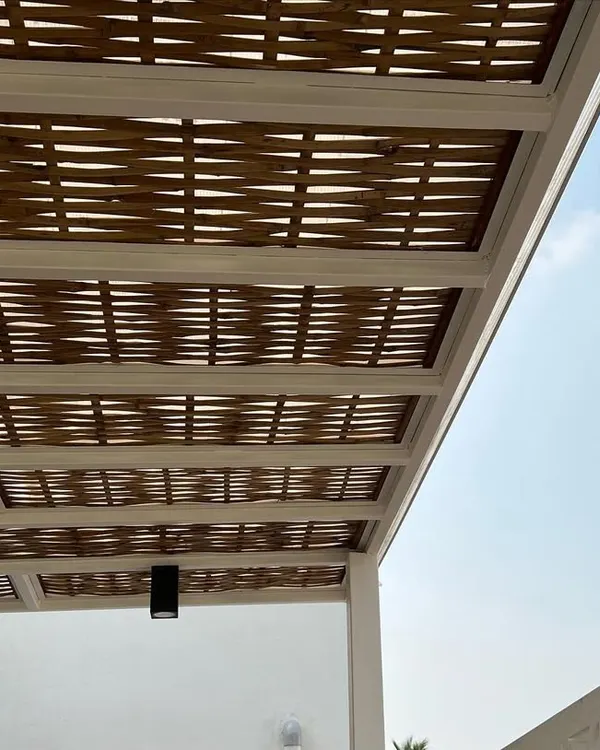 I love the detail in this hand-woven bamboo pergola. It provides about 80% shade from the sun and is protected with a polycarbonate sheet, making it both beautiful and practical.