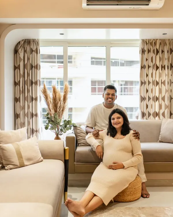 A beautiful family portrait right in their living room. At-home sessions are so special because they capture you in your own environment. This couple looks so relaxed and happy in their beautifully decorated space.