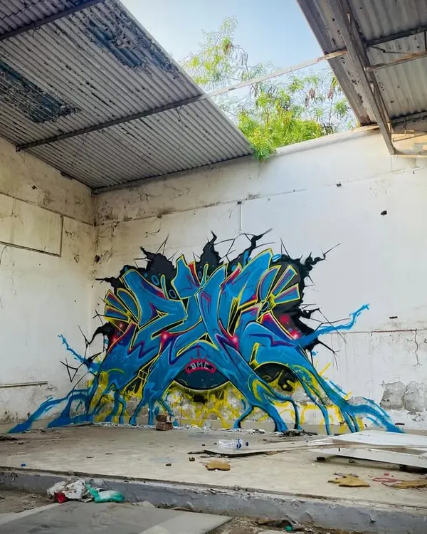 A different perspective of the 'Revival' piece, showing how the artwork seems to burst out from the dilapidated wall, bringing new life to an abandoned space.