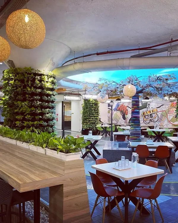 We transformed the concrete pillars in this office cafeteria into living green columns. These vertical gardens not only improve the aesthetics but also help purify the air, creating a more pleasant dining environment for employees.