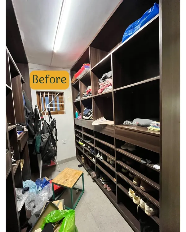 This is the before shot of a walk-in closet where shoes and bags were disorganized, making it hard to find pairs and creating a cluttered look.