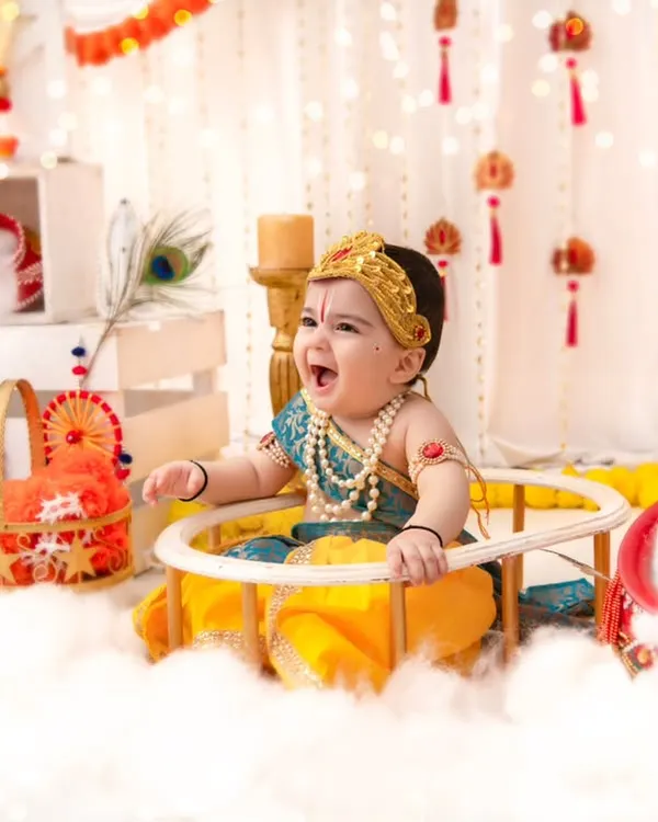 A joyful 'Little Kanha' laughing with delight. I focus on capturing genuine expressions, even in highly stylized and themed shoots like this one.