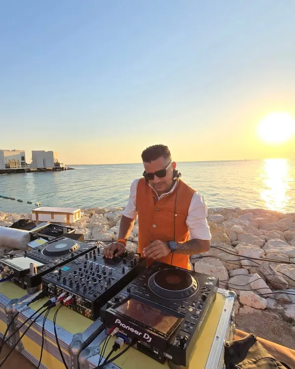 Playing a sunset session by the sea in Bahrain. There's nothing like mixing music with the sound of the waves and a beautiful sunset view for a destination wedding.