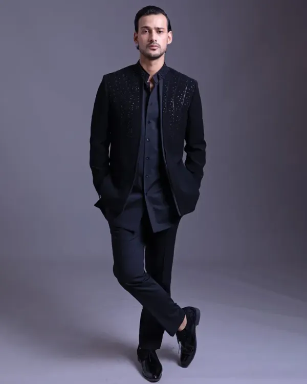 An open designer bandhgala paired with a kurta. This look is the epitome of minimal, elegant, and timeless style, offering a versatile option for any semi-formal or celebratory occasion.