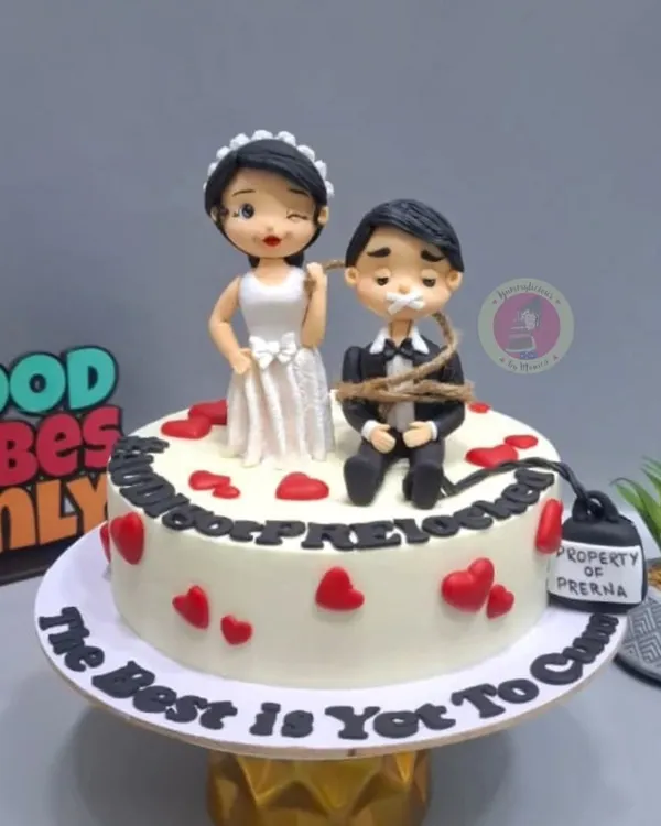 Our bestseller bridal shower cake featuring a playful, handmade bride and groom figurine. It’s a cute and fun way to celebrate without being explicit.