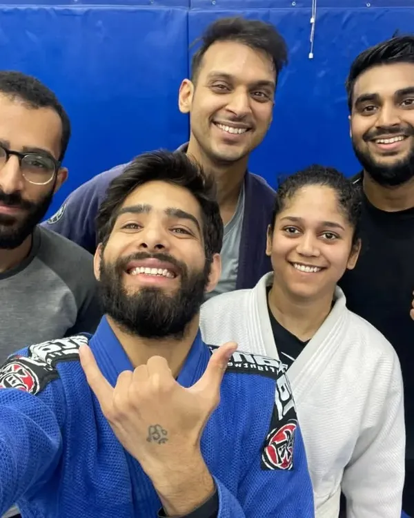 A happy group of students in their blue and white Gis after a fundamentals class.