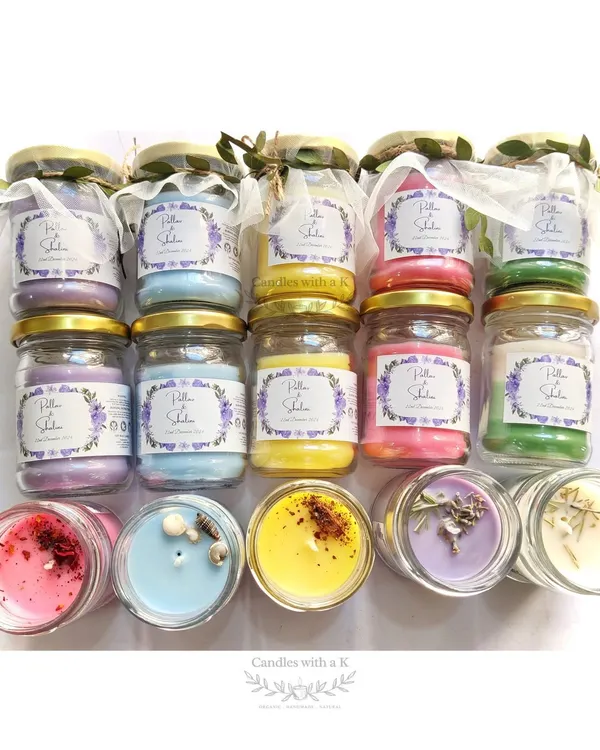 A vibrant collection of 100ml jar candles created for a bride, Shalini. The order included five different scents and designs, from layered candles to botanical toppings.