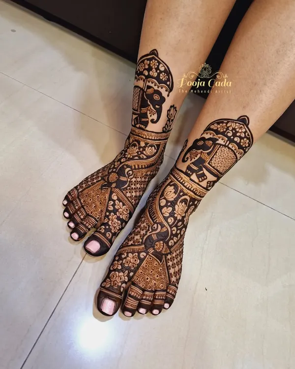 Our team's artistry extends to creating stunning bridal leg henna. This design features decorated elephants in a traditional style, with detailed patterns covering the entire foot for a truly complete look.