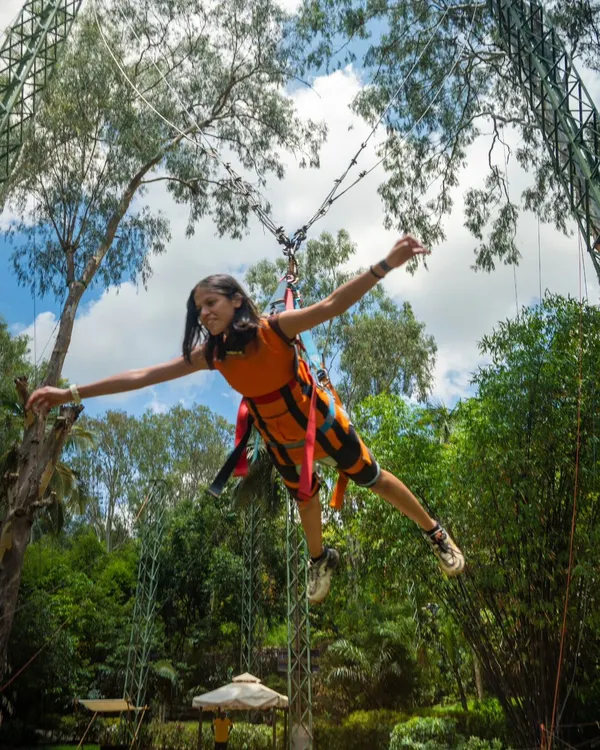 This is the Superman Swing. You're harnessed in face-first, so you literally feel like you're flying over the trees. It's an unforgettable experience for any thrill-seeker.