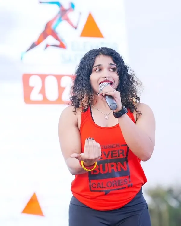 Leading the crowd with energy and passion. In my dance fitness sessions, I make sure everyone feels the beat and has a great time while getting a fantastic workout.