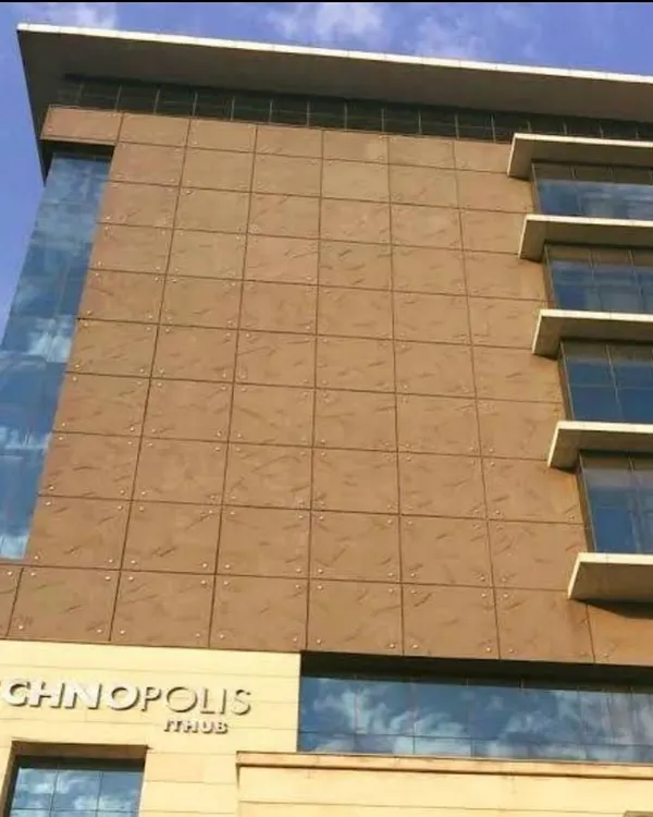 The facade of the Technopolis IT Hub, showcasing its clean lines and material combination. The design has remained relevant and functional for nearly two decades, a hallmark of our forward-thinking approach to corporate architecture.