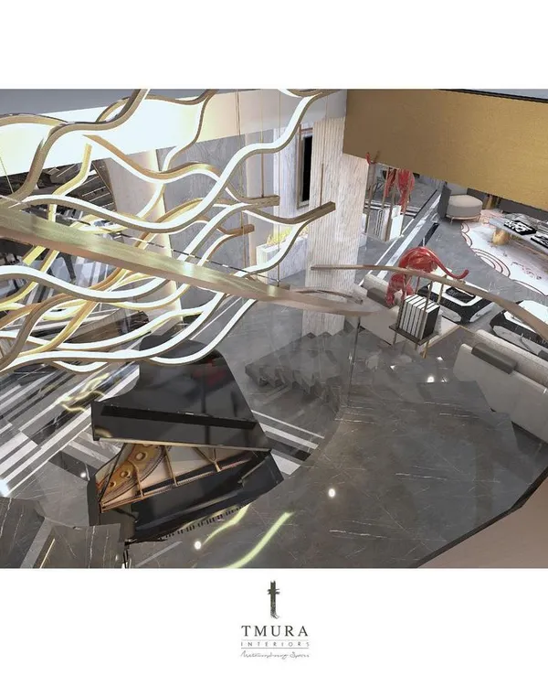 An aerial view of a custom chandelier that flows like a river of light above the staircase. This piece was designed to be beautiful from every angle, whether viewed from above, below, or the side.