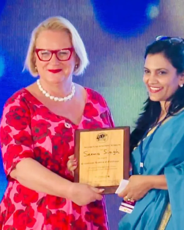 Receiving the "Iconic Women Creating a Better World for All" award at the Women Economic Forum. It was an honour to be recognized for my work in promoting health and wellness.