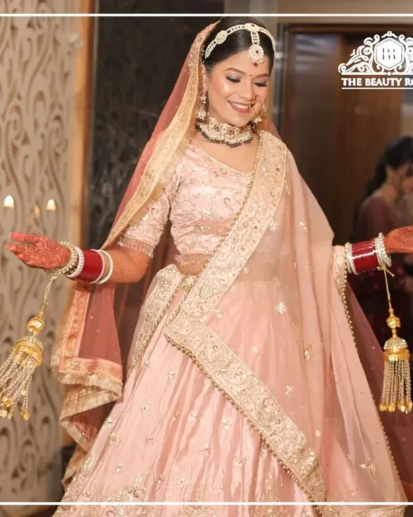 This bride is a vision in her pastel pink lehenga. I created a fresh, dewy makeup look with soft pink tones and a subtle shimmer to give her an ethereal glow.