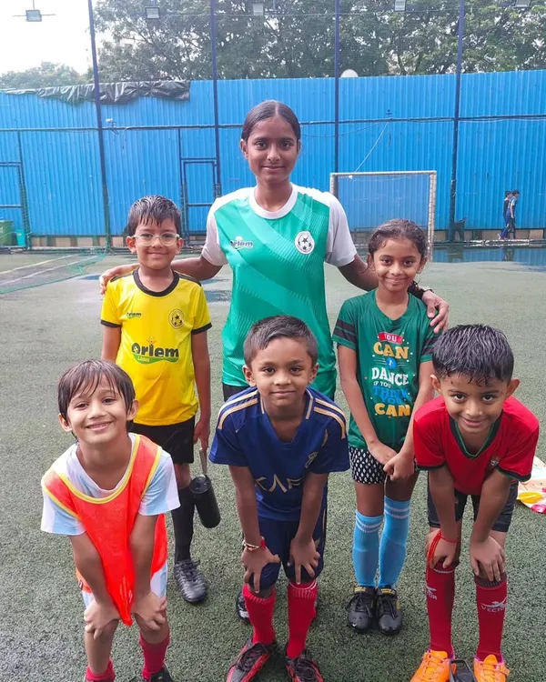 A coach with our weekend batch, which includes young girls just starting their football journey. We are proud to offer an inclusive environment for all.