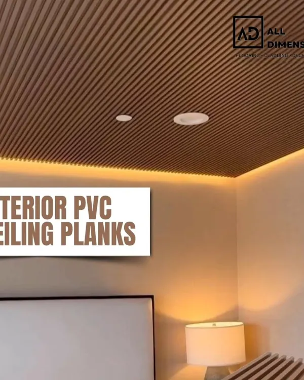 A bedroom ceiling featuring brown interior PVC planks with integrated cove lighting. This design adds a warm, cozy, and modern finish to the room, making the ceiling a key feature.