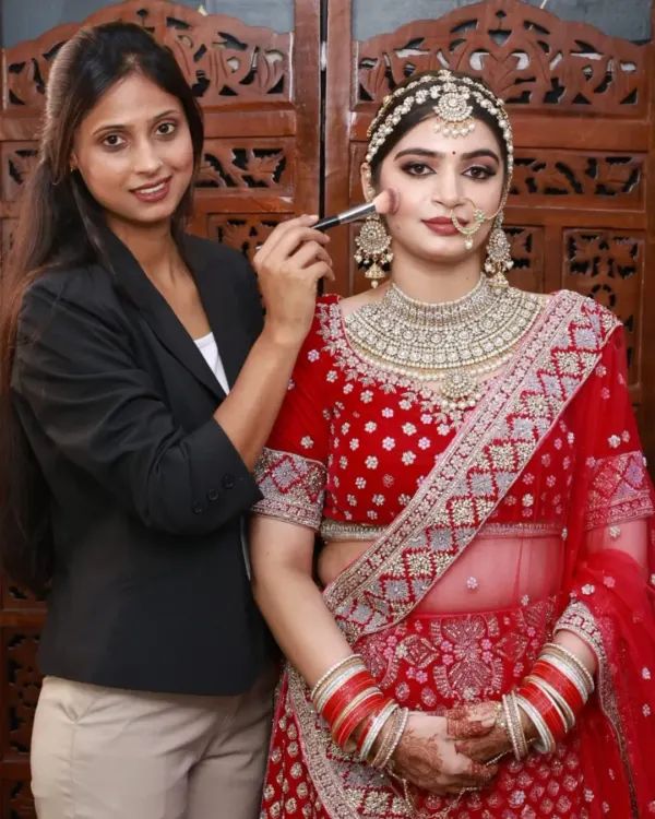 I'm so proud of the work my students produce. Here is a student from my academy applying makeup on a model, creating a flawless bridal base.