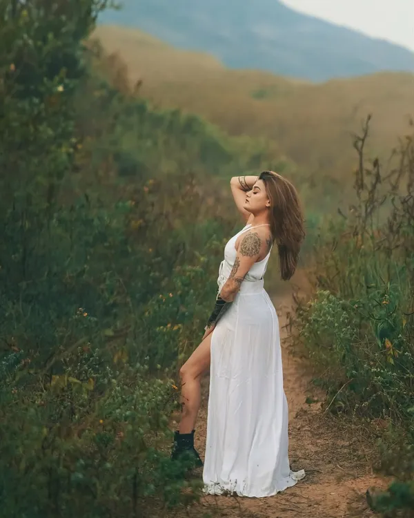 A moment of freedom in the wilderness. The wild, open landscape and the soft, diffused light create a dreamy and powerful portrait.