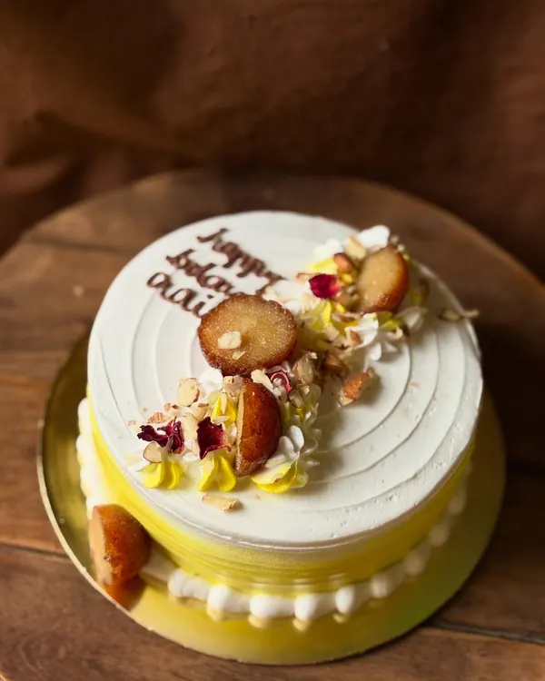 My signature Gulabjamun Rabdi cake. This fusion dessert combines a soft, moist cake with the flavors of creamy rabdi, and is topped with actual gulab jamuns.