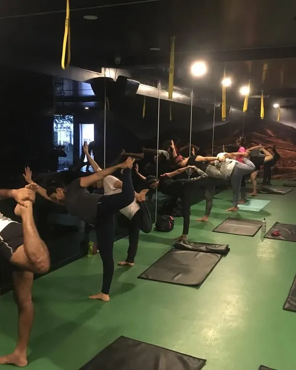 A group of students finding their balance in Natarajasana (Lord of the Dance Pose). In my classes, we work together to improve concentration and stability, one pose at a time.