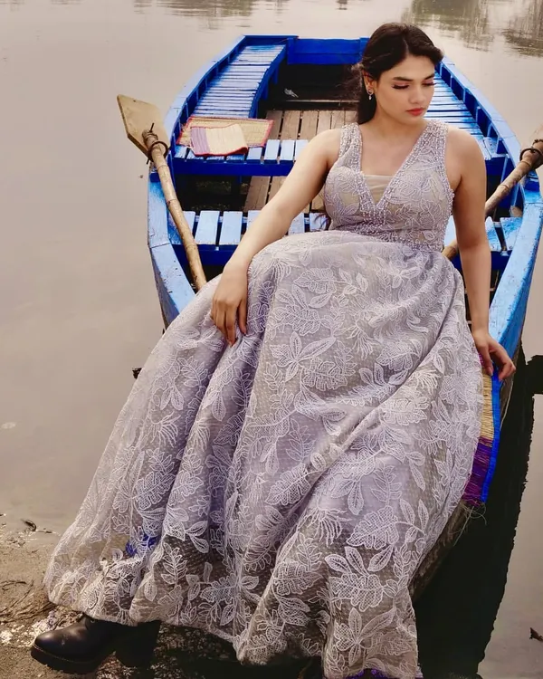 This beautiful grey gown with delicate floral lace embroidery was styled for a serene concept shoot on the water. The full skirt creates a lovely, soft silhouette.