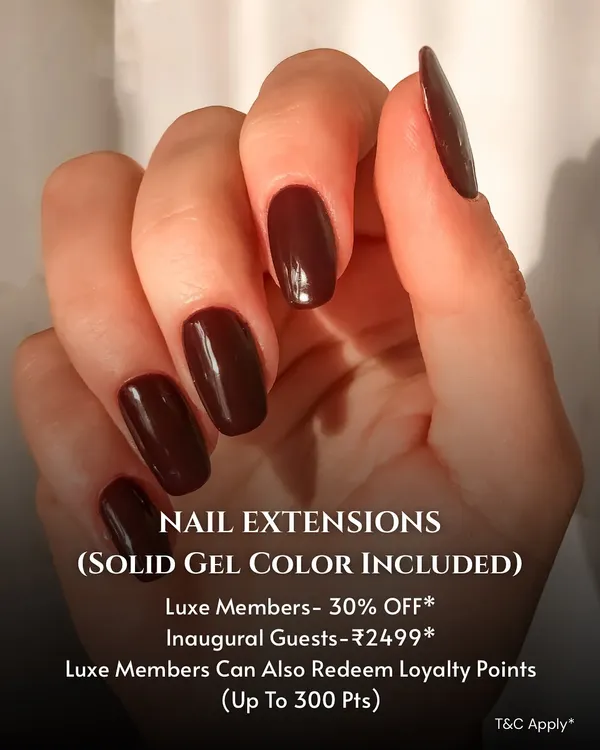 A classic and bold look featuring long, sculpted nail extensions with a solid, deep maroon gel color. This image showcases a flawless application and a rich, glossy finish.