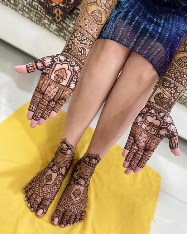 This is a perfect example of a full bridal mehandi set. The intricate designs on the hands and feet complement each other beautifully, creating a complete and stunning look.