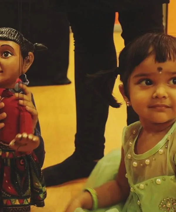 There is nothing more priceless than this moment of connection. We see a child whispering a secret to one of our handmade puppets, a beautiful reminder of why we love bringing stories to life.