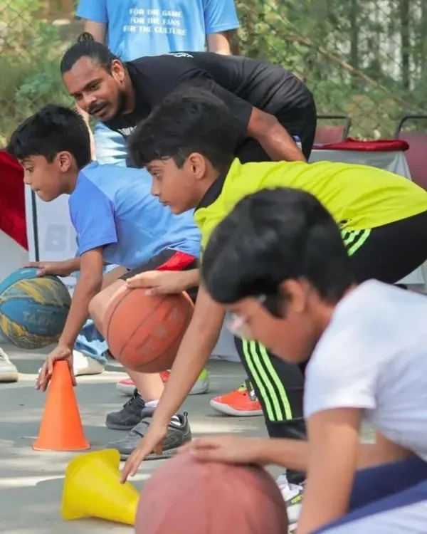 Find your passion, whatever it may be. Here I am working with a group of young hoopers, teaching them the basics of dribbling in a fun, engaging way.