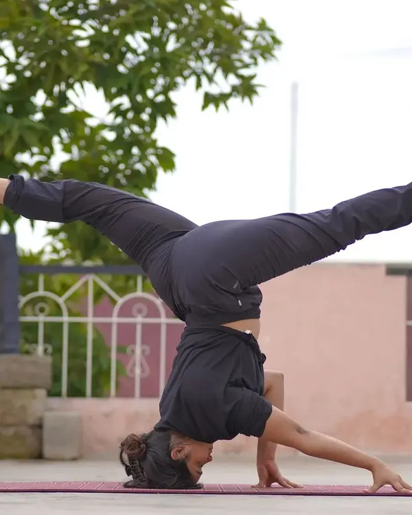 Playing with a split in a headstand. Once you're comfortable with the basics of an inversion, we can explore fun and challenging variations like this to build more core control.