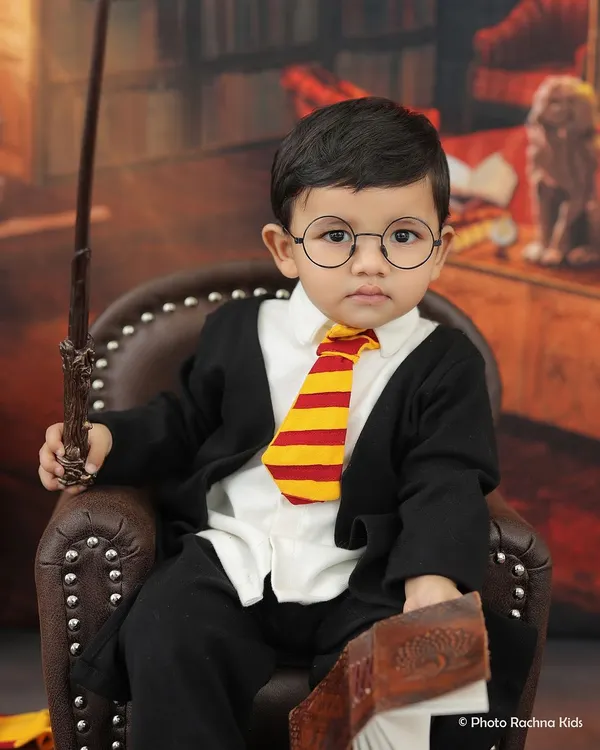 Our little Harry Potter, complete with a Gryffindor tie and wand. This is one of our most requested themed shoots for toddlers.