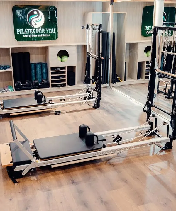 A look at our fully equipped studio. With multiple reformers, Cadillac towers, and stability chairs, I have everything needed to provide a comprehensive and varied Pilates experience.