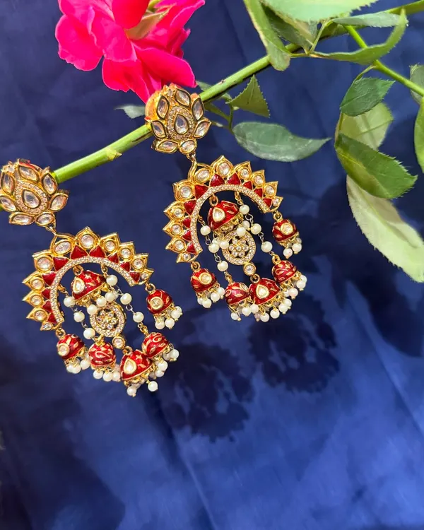 Introducing our exclusive traditional jewellery. These stunning red and white meenakari chandbalis with jhumkas speak of royalty in every detail.